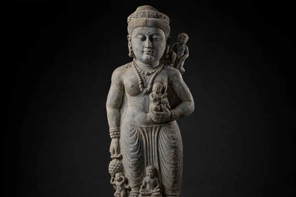 Gandharan schist statue representing the fertility deity Hariti in Greco-Roman style.